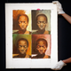 A Sotheby's employee adjusts the oil on canvas painting 'A La Warhol' by Njideka Akunyili Crosby in London, Friday, March 23, 2018. The painting, estimated 50,000 - 70,000GBP (70,000-98,000USD) is part of a Modern and Contemporary African Art Sale at the auction house Sotheby's. (AP Photo/Frank Augstein)